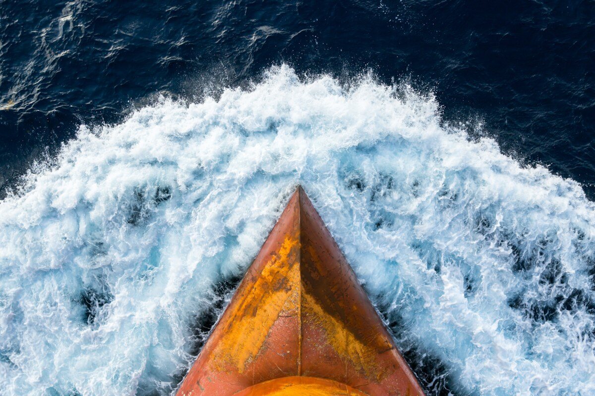 Bow of a ship breaking waves